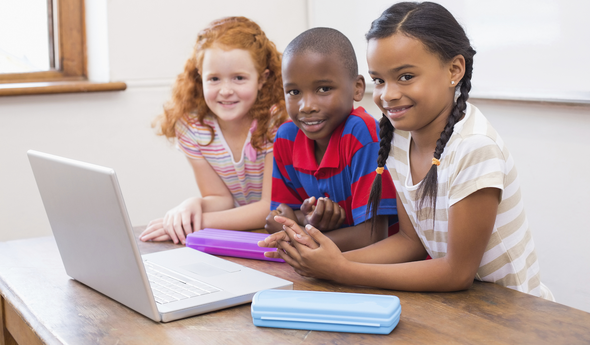 Three young clients of the PSU Speech and Hearing clinic